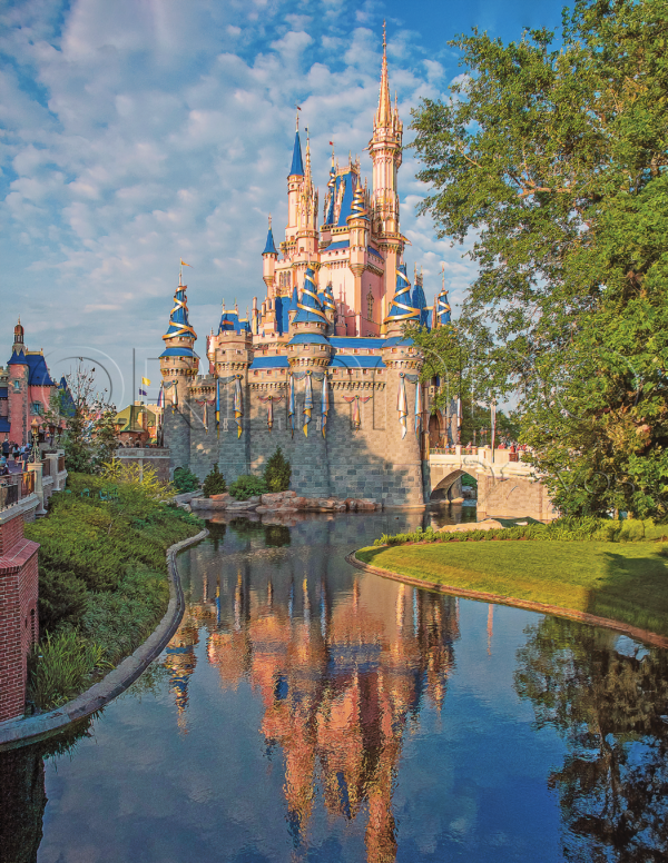 Cinderella Castle silhouette takes on a magical glow from a side view at Magic Kingdom